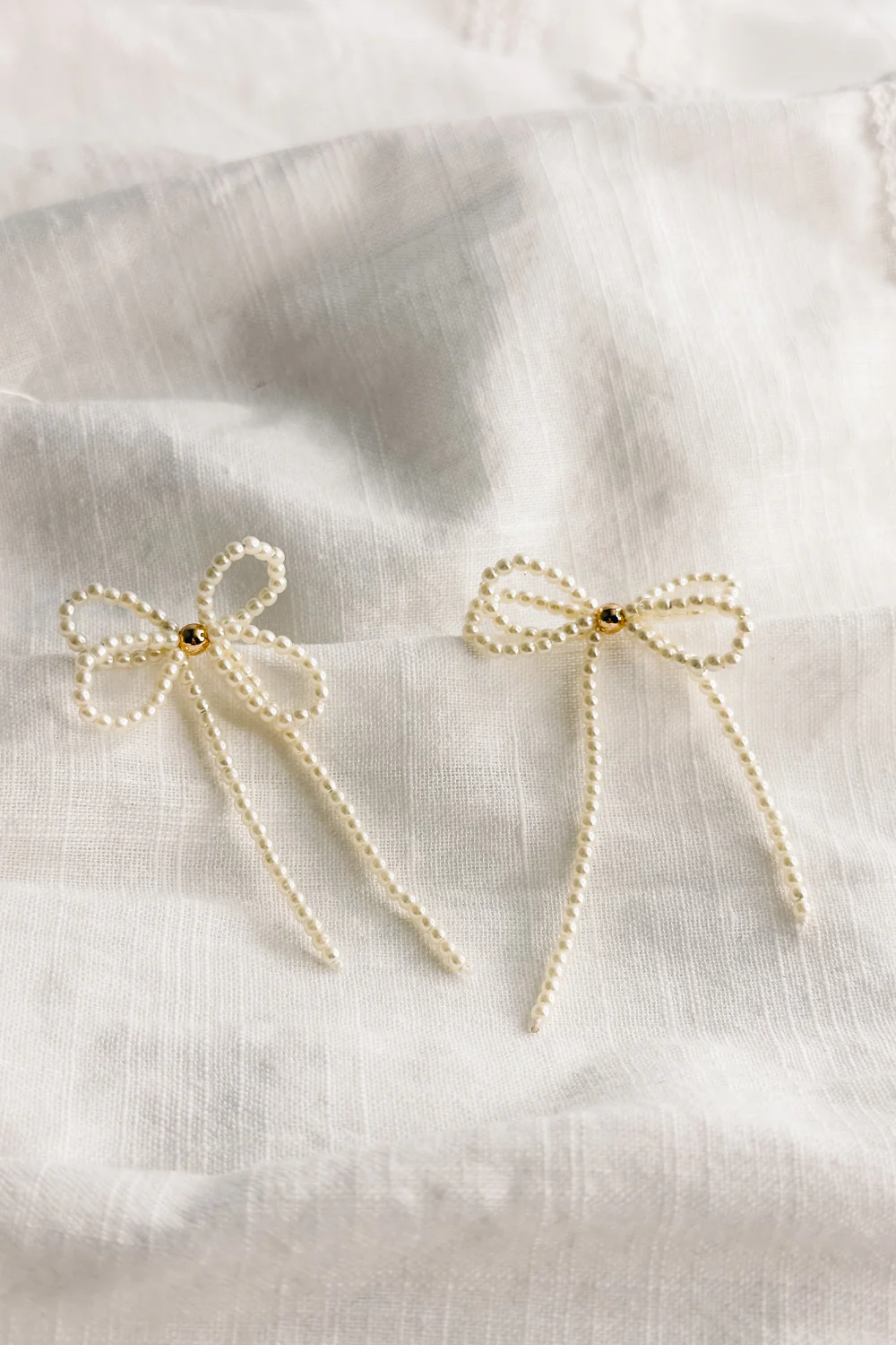 Tarah Cream Pearl Bow Dangle Earrings - Image 4